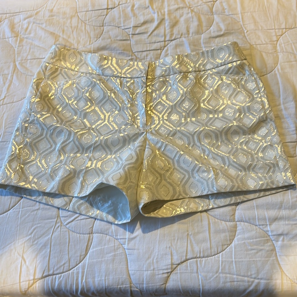 White House Black Market gold shimmer shorts. 5 in. size 12 brand new with tags.